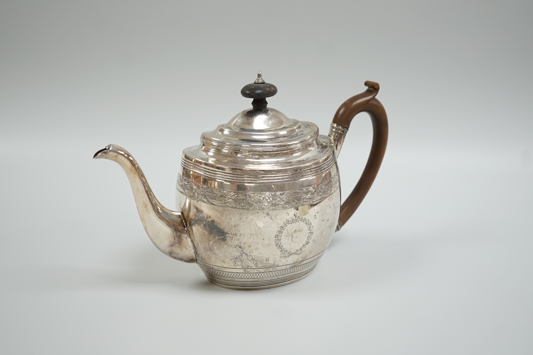 A George III engraved silver oval teapot, Thomas Wallis II?, London, 1802, gross weight 15.5oz.